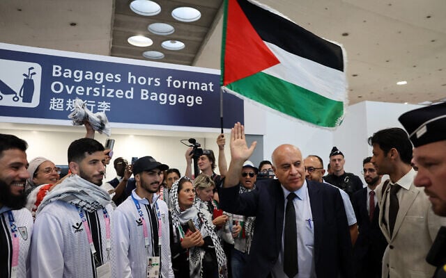 Jibril Rajoub, president of the Palestinian Football Association and the Palestine Olympic Committee, Palestinian Olympic athletes and members of the delegation arrive at Charles-de-Gaulle Airport, north of Paris, on July 25, 2024. (Ahmad GHARABLI / AFP) Jibril Rajoub, president of the Palestinian Football Association and the Palestine Olympic Committee, Palestinian Olympic athletes and members of the delegation arrive at Charles-de-Gaulle Airport, north of Paris, on July 25, 2024. (Ahmad GHARABLI / AFP)