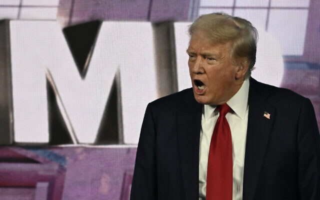 Former US president and 2024 Republican presidential nominee Donald Trump arrives onstage to speak at Turning Point Action's "The Believers Summit" in West Palm Beach, Florida, on July 26, 2024. (Chandan Khanna/AFP)