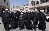 Elders and mourners attend the funeral of Gevara Ebraheem, 11, killed in a Hezbollah strike from Lebanon two days earlier, in the Druze town of Majdal Shams in the Golan on July 29, 2024. (Jalaa Marey / AFP)