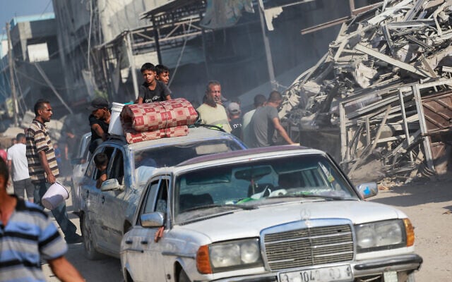 Displaced Palestinians leave western Khan Yunis to areas in the eastern parts of the city following reports of Israeli forces withdrawing from the area in the southern Gaza Strip on July 30, 2024. (Bashar Taleb/AFP) Displaced Palestinians leave western Khan Yunis to areas in the eastern parts of the city following reports of Israeli forces withdrawing from the area in the southern Gaza Strip on July 30, 2024. (Bashar Taleb/AFP)
