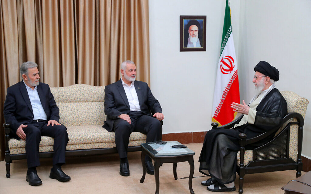 A handout picture provided by the office of Iran's Supreme Leader Ayatollah Ali Khamenei shows him (R) meeting with leaders of the Palestinian Hamas movement Ismail Haniyeh (C) and the Islamic Jihad group Ziad Nakhaleh in Tehran on July 30, 2024. (KHAMENEI.IR/AFP)