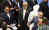 Hamas leader Ismael Haniyeh arrives for the inauguration of the new Iranian president at the parliament in Tehran, on July 30, 2024. (Photo by AFP)