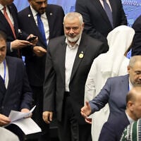 Hamas leader Ismael Haniyeh arrives for the inauguration of the new Iranian president at the parliament in Tehran, on July 30, 2024. (Photo by AFP)