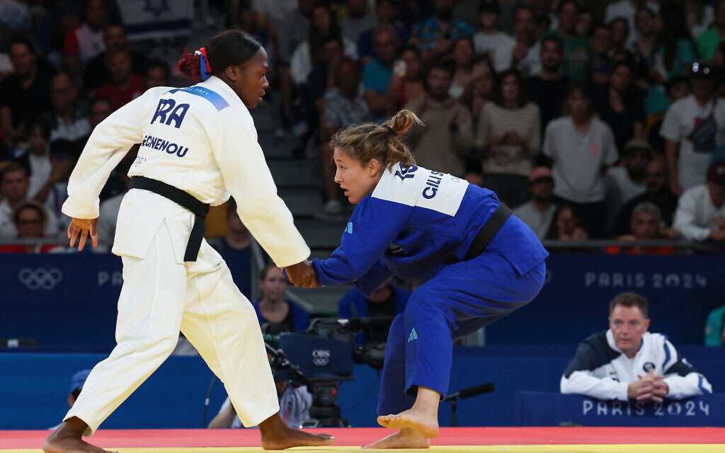 France's Clarisse Agbegnenou and Israel's Gili Sharir (blue) compete in the judo women's -63kg match at the Paris 2024 Olympic Games at the Champ-de-Mars Arena, in Paris, July 30, 2024. (Jack GUEZ / AFP)