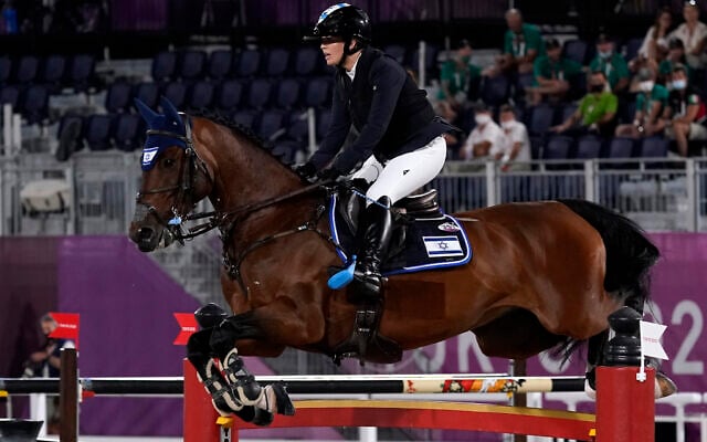 Ashlee Bond, riding Donatello 141, competes during the equestrian jumping individual final at Equestrian Park in Tokyo at the 2020 Summer Olympics, Aug. 4, 2021, in Tokyo, Japan. (AP Photo/Carolyn Kaster)