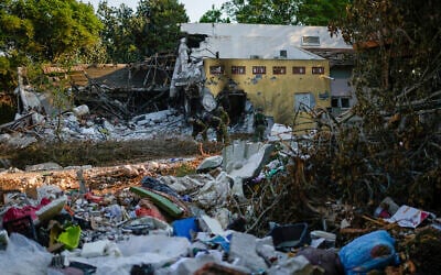 Israeli soldiers walk past houses destroyed by Hamas terrorists on Oct. 7, 2023, in Kibbutz Be'eri, Oct. 14, 2023. (AP Photo/Ariel Schalit) Israeli soldiers walk past houses destroyed by Hamas terrorists on Oct. 7, 2023, in Kibbutz Be'eri, Oct. 14, 2023. (AP Photo/Ariel Schalit)
