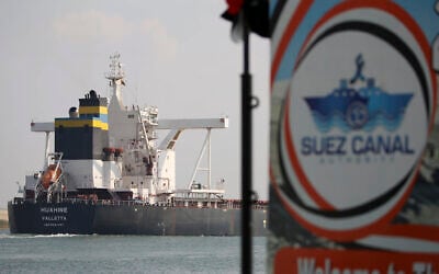 A cargo ship sails through the town of Ismailia, Egypt, March 30, 2021. (AP/Ayman Aref)