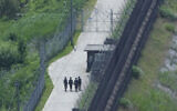 South Korean army soldiers patrol along the barbed-wire fence in Paju, near the border with North Korea, June 27, 2024. (Ahn Young-joon/AP)