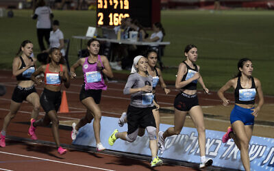 Beatie Deutsch, an Orthodox Jewish runner, fourth from right, competes in a 1500-meter run in Tel Aviv, June 26, 2024. (AP Photo/Maya Alleruzzo)