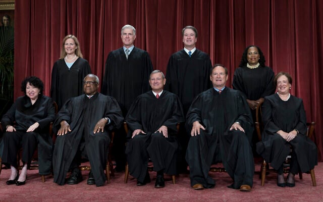 Members of the Supreme Court sit for a group portrait in Washington, Oct. 7, 2022. Bottom row, from left, Justice Sonia Sotomayor, Justice Clarence Thomas, Chief Justice John Roberts, Justice Samuel Alito and Justice Elena Kagan. Top row, from left, Justice Amy Coney Barrett, Justice Neil Gorsuch, Justice Brett Kavanaugh, and Justice Ketanji Brown Jackson. The Supreme Court justices will take the bench Monday, July 1, 2024, to release their last few opinions of the term, including their most closely watched case: whether former President Donald Trump has immunity from criminal prosecution. (AP Photo/J. Scott Applewhite, file)