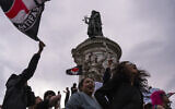 People gather at Republique plaza to protest the far-right National Rally, which came out strongly ahead in first-round legislative elections, in Paris, June 30, 2024. (Louise Delmotte/AP)