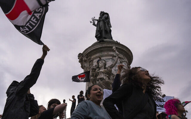 People gather at Republique plaza to protest the far-right National Rally, which came out strongly ahead in first-round legislative elections, in Paris, June 30, 2024. (Louise Delmotte/AP) People gather at Republique plaza to protest the far-right National Rally, which came out strongly ahead in first-round legislative elections, in Paris, June 30, 2024. (Louise Delmotte/AP)