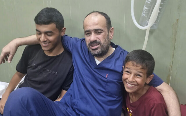 This video grab shows Mohammed Abu Selmia, former director of Shifa Hospital, who was detained by Israeli forces in November, sitting with his family after his release, along with other detainees, at a hospital in Khan Younis, Gaza Strip on Monday, July 1, 2024. (AP Photo/Mohammad Jahjouh) This video grab shows Mohammed Abu Selmia, former director of Shifa Hospital, who was detained by Israeli forces in November, sitting with his family after his release, along with other detainees, at a hospital in Khan Younis, Gaza Strip on Monday, July 1, 2024. (AP Photo/Mohammad Jahjouh)