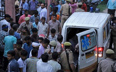 A person injured in a stampede at a religious gathering arrives in an ambulance at the Sikandrarao hospital in Hathras district about 350 kilometers (217 miles) southwest of Lucknow, India, July 2, 2024. (AP Photo/Manoj Aligadi)