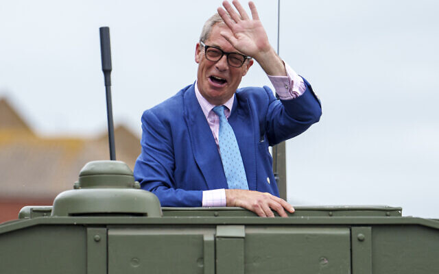 Nigel Farage, leader of Reform UK, waves from inside a jeep at the end of an electoral rally at Clacton Pier in Clacton-on-Sea, England, July 3, 2024. (AP Photo/Vadim Ghirda) Nigel Farage, leader of Reform UK, waves from inside a jeep at the end of an electoral rally at Clacton Pier in Clacton-on-Sea, England, July 3, 2024. (AP Photo/Vadim Ghirda)