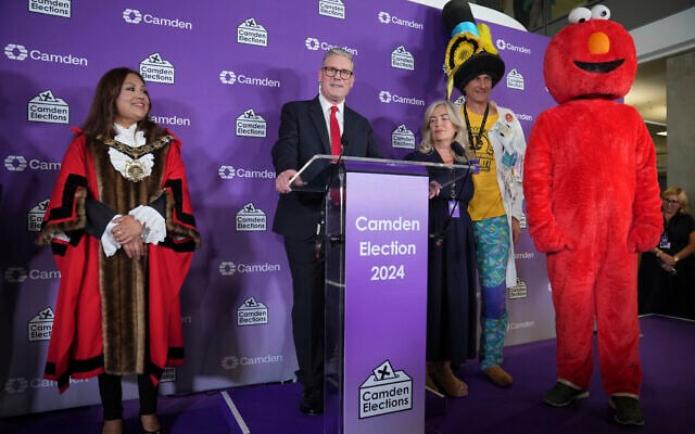 Britain's Labour Party leader Keir Starmer speaks on stage after he was elected for the Holborn and St Pancras constituency, in London, Friday, July 5, 2024. (AP Photo/Kin Cheung)