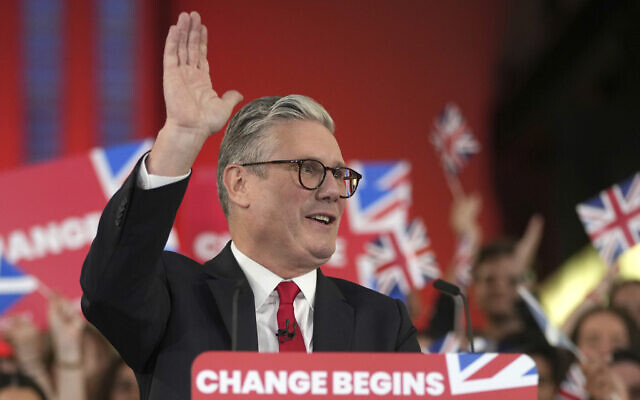 Labour Party leader Keir Starmer waves to party workers and supporters during a post election rally at the Tate Modern in London, July 5, 2024. (AP Photo/Kin Cheung)