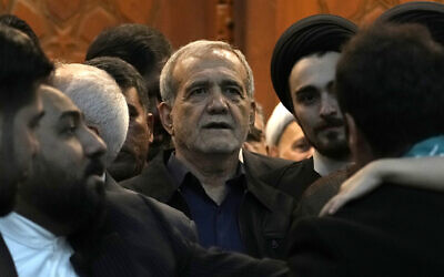 Iran's President-elect Masoud Pezeshkian arrives to attend a meeting a day after the presidential election, at the shrine of the late revolutionary founder Ayatollah Khomeini, just outside Tehran, Iran, July 6, 2024. (AP Photo/Vahid Salemi)