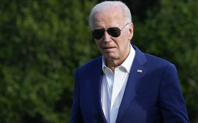 US President Joe Biden walks across the South Lawn of the White House in Washington, July 7, 2024, after returning from a trip to Pennsylvania. (AP Photo/ Susan Walsh)