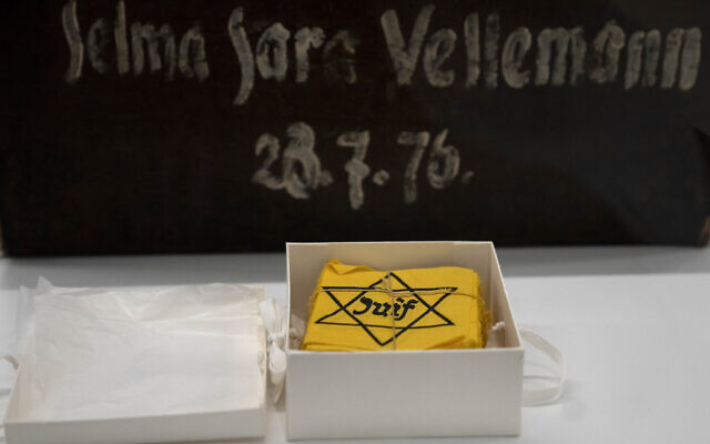 Yellow badges and a piece of luggage are displayed at Yad Vashem in Jerusalem, July 8, 2024. (AP Photo/Maya Alleruzzo)