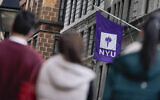 FILE - People wait in line at a COVID-19 testing site near the New York University campus, Dec. 16, 2021, in New York. (AP Photo/Seth Wenig, File)