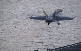 An F/A-18 Super Hornet launches off the flight deck of the Nimitz-class aircraft carrier USS Theodore Roosevelt on July 5, 2024, in the South China Sea. The Roosevelt is replacing the USS Dwight D. Eisenhower in the Navy's campaign against attacks by Yemen's Houthi rebels targeting shipping in the Red Sea corridor over the Israel-Hamas war in the Gaza Strip. (Seaman Aaron Haro Gonzalez/US Navy, via AP)