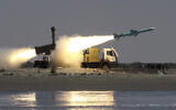 A Noor missile is launched from the coast to the sea during Iranian naval maneuvers in the Oman Sea, near the port town of Bandar Jask, Iran on May 11, 2010. (Hossein Zohrevand/Fars News Agency/AP)
