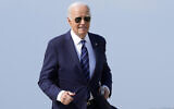US President Joe Biden walks over to speak with reporters at Andrews Air Force Base, Maryland, July 15, 2024, as he heads to Las Vegas. (AP Photo/Susan Walsh)