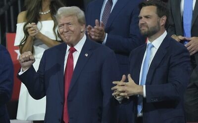 Republican US presidential candidate former president Donald Trump, left, and Republican vice presidential candidate Senator JD Vance appear during the Republican National Convention, July 15, 2024, in Milwaukee. (AP Photo/Matt Rourke)