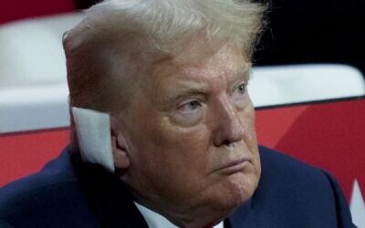 Republican presidential candidate former President Donald Trump watches during the Republican National Convention, Monday, July 15, 2024, in Milwaukee. (AP Photo/Charles Rex Arbogast)