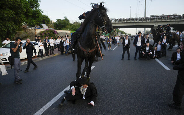 Israeli mounted police disperse Ultra-Orthodox Jews blocking a highway during a protest against military recruitment in Bnei Brak, near Tel Aviv, Israel, Tuesday, July 16, 2024. (AP Photo/Ohad Zwigenberg) Israeli mounted police disperse Ultra-Orthodox Jews blocking a highway during a protest against military recruitment in Bnei Brak, near Tel Aviv, Israel, Tuesday, July 16, 2024. (AP Photo/Ohad Zwigenberg)