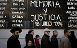 The names of bombing victims and the Spanish phrase "Memory and Justice" cover a wall after a ceremony was held to mark the 30th anniversary of the bombing of the AMIA Jewish center that killed 85 people in Buenos Aires, Argentina, Thursday, July 18, 2024. (AP/Natacha Pisarenko)
