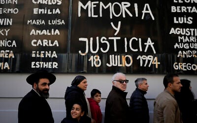 The names of bombing victims and the Spanish phrase "Memory and Justice" cover a wall after a ceremony was held to mark the 30th anniversary of the bombing of the AMIA Jewish center that killed 85 people in Buenos Aires, Argentina, Thursday, July 18, 2024. (AP/Natacha Pisarenko)