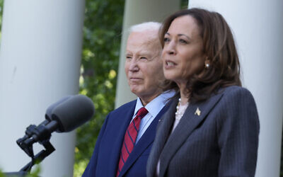 US President Joe Biden listens as Vice President Kamala Harris speaks in the Rose Garden of the White House in Washington, May 13, 2024. (Susan Walsh/AP)