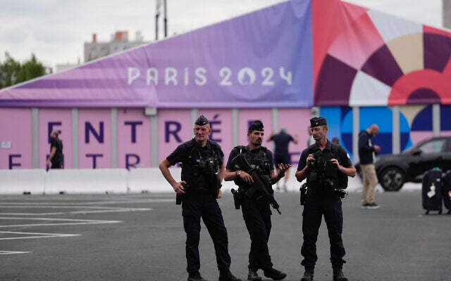 Police stand watch outside the Olympic Village, at the 2024 Summer Olympics, July 23, 2024, in Paris, France. (AP Photo/Rebecca Blackwell) Police stand watch outside the Olympic Village, at the 2024 Summer Olympics, July 23, 2024, in Paris, France. (AP Photo/Rebecca Blackwell)