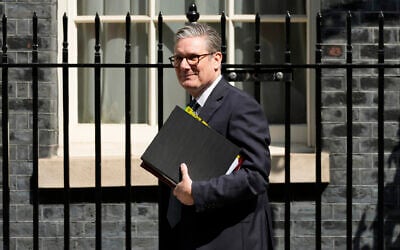 British Prime Minister Keir Starmer leaves 10 Downing Street to attend the weekly Prime Ministers' Questions session in parliament in London, July 24, 2024. (AP Photo/Frank Augstein)