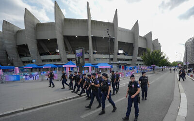 Police clear the streets outside the stadium ahead of the men's group D match between Israel and Mali at the Parc des Princes during the 2024 Summer Olympics in Paris, July 24, 2024. (AP Photo/Rebecca Blackwell)