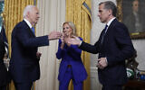 US President Joe Biden, left, greets his son Hunter Biden after addressing Americans from the Oval Office of the White House in Washington, July 24, 2024, about his decision to drop his Democratic presidential reelection bid, as first lady Jill Biden watches. (AP Photo/Evan Vucci, Pool)