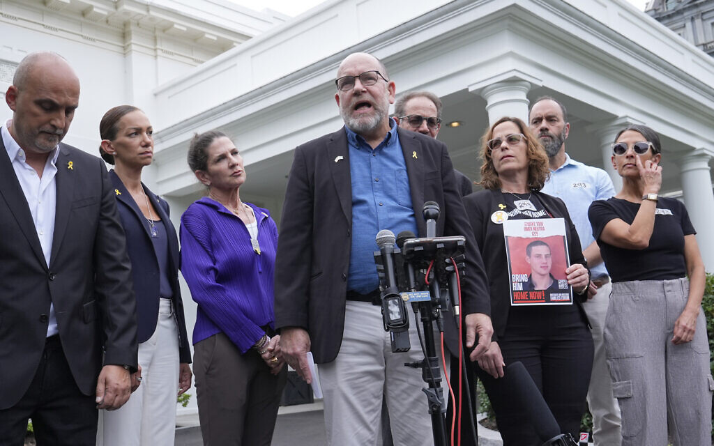 Jonathan Dekel-Chen, center, father of American hostage Sagui Dekel-Chen, along with other families of hostages in Gaza, speaks with reporters following their meeting with US President Joe Biden and Prime Minister Benjamin Netanyahu at the White House in Washington, July 25, 2024. (AP/Susan Walsh)