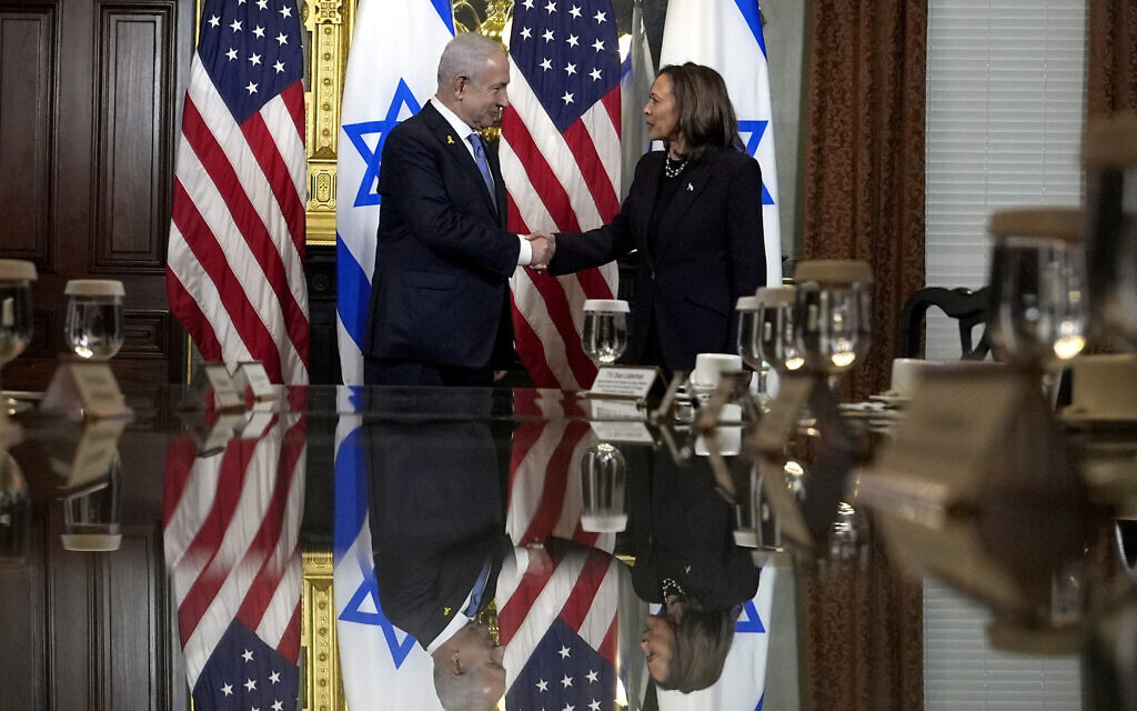US Vice President Kamala Harris, right, shakes hands with Prime Minister Benjamin Netanyahu before a meeting at the Eisenhower Executive Office Building on the White House complex in Washington, Thursday, July 25, 2024. (AP/Julia Nikhinson)