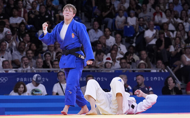 Hungary's Rekka Pupp celebrates after defeating Israel's Gefen Primo during their women -52 kg repechage round match in team judo competition at Champ-de-Mars Arena at the 2024 Summer Olympics, July 28, 2024, in Paris, France. (AP/Eugene Hoshiko) Hungary's Rekka Pupp celebrates after defeating Israel's Gefen Primo during their women -52 kg repechage round match in team judo competition at Champ-de-Mars Arena at the 2024 Summer Olympics, July 28, 2024, in Paris, France. (AP/Eugene Hoshiko)