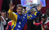 Venezuelan President Nicolas Maduro addresses supporters gathered outside the Miraflores presidential palace after electoral authorities declared him the winner of the presidential election in Caracas, Venezuela, Monday, July 29, 2024. (AP Photo/Fernando Vergara)