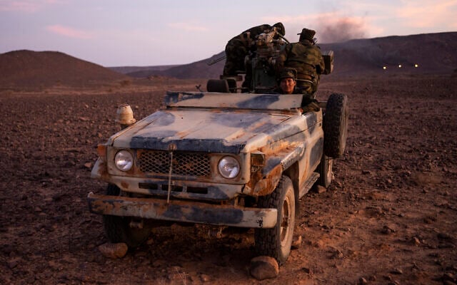Polisario Front soldiers during a shooting exercise near Mehaires, Western Sahara on October 13, 2021. (Bernat Armangue/AP) Polisario Front soldiers during a shooting exercise near Mehaires, Western Sahara on October 13, 2021. (Bernat Armangue/AP)