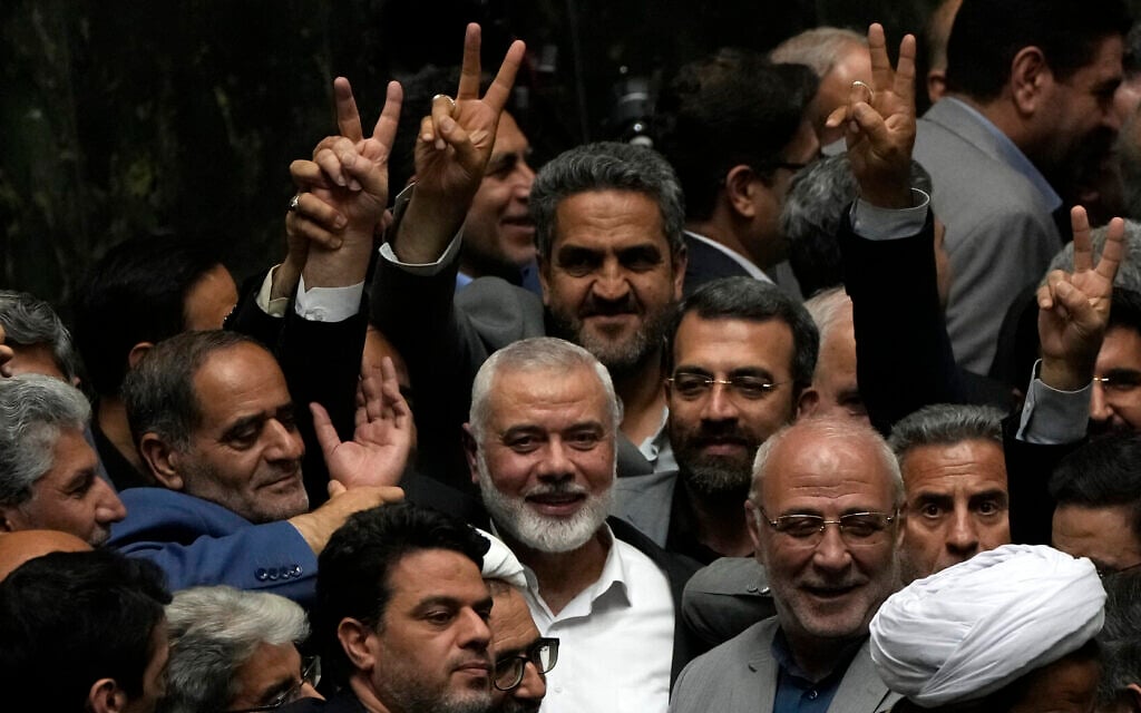 Ismael Haniyeh, leader of the terrorist group Hamas, surrounded by lawmakers flashes the victory sign during the swearing-in ceremony for the new Iranian president, at the parliament in Tehran on July 30, 2024. (AP Photo/Vahid Salemi) Ismael Haniyeh, leader of the terrorist group Hamas, surrounded by lawmakers flashes the victory sign during the swearing-in ceremony for the new Iranian president, at the parliament in Tehran on July 30, 2024. (AP Photo/Vahid Salemi)