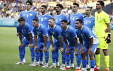 The Israeli team poses prior to the Group D soccer match between Israel and Japan, at the La Beaujoire stadium, at the 2024 Summer Olympics, July 30, 2024, in Nantes, France. (AP Photo/Jeremias Gonzalez)