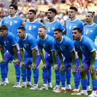 The Israeli team poses prior to the Group D soccer match between Israel and Japan, at the La Beaujoire stadium, at the 2024 Summer Olympics, July 30, 2024, in Nantes, France. (AP Photo/Jeremias Gonzalez)