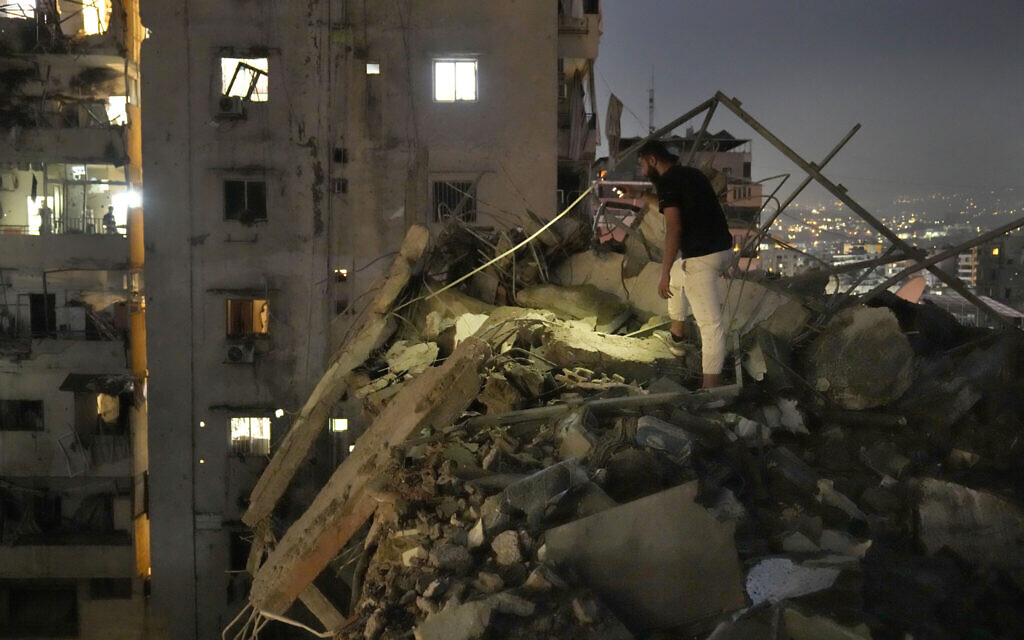 A man inspects damage following an Israeli airstrike in the southern suburbs of Beirut, Lebanon, Tuesday, July 30, 2024. (AP/Hussein Malla)