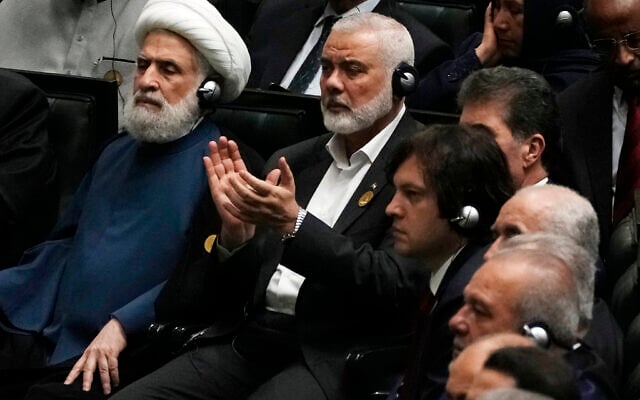 Hamas chief Ismail Haniyeh claps as newly-elected Iranian President Masoud Pezeshkian speaks while deputy leader of the Lebanese terror group Hezbollah, Sheikh Naim Kassem, left, sits during the swearing-in ceremony of Pezeshkian at the Iranian parliament, in Tehran, Iran, Tuesday, July 30, 2024. (AP Photo/Vahid Salemi) Hamas chief Ismail Haniyeh claps as newly-elected Iranian President Masoud Pezeshkian speaks while deputy leader of the Lebanese terror group Hezbollah, Sheikh Naim Kassem, left, sits during the swearing-in ceremony of Pezeshkian at the Iranian parliament, in Tehran, Iran, Tuesday, July 30, 2024. (AP Photo/Vahid Salemi)