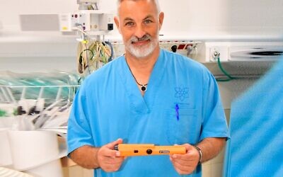 An undated photo of Dr. Eyal Sela with the metal detector at the Galilee Medical Center. (Roni Albert)