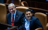 Prime Minister Benjamin Netanyahu (left) sits with Diaspora Affairs Minister Amichai Chikli, at the Knesset plenum in Jerusalem, June 26, 2023. (Yonatan Sindel/Flash90)